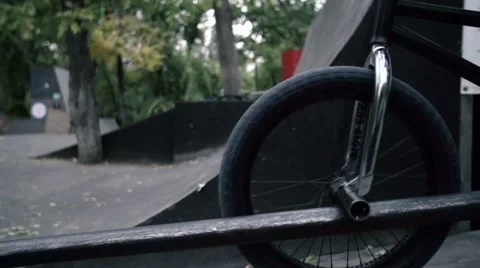 EDITORIAL Boy going rail slide on BMX bike. Slow motion 400fps in city park Video stock 57114772