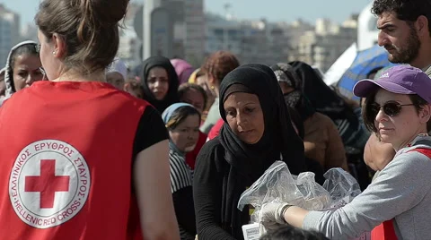 EDITORIAL:  Charitable organization Red Cross handed out refugees food and water Stock Footage 62297105