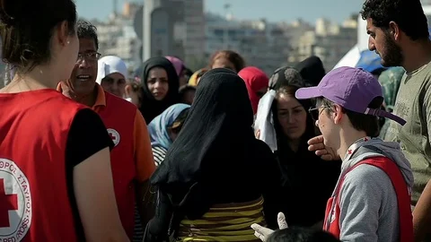Editorial: Charitable organization Red Cross handed out refugees food and water Stock Footage 72986521