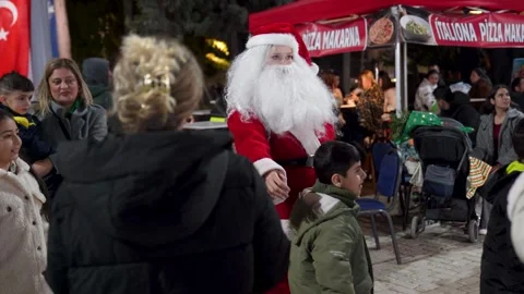 Editorial: Children Posing with Mrs. Claus at New Year Fair, Izmir, Dec 20, 2025 Stock Footage 324645923