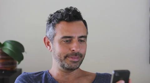 Editorial clip of man using Facetime on Iphone Stock Footage 40525449