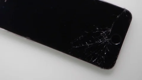 Editorial - Cracked lcd screen on new Apple Iphone - View from above and zoom in Видео 125679238