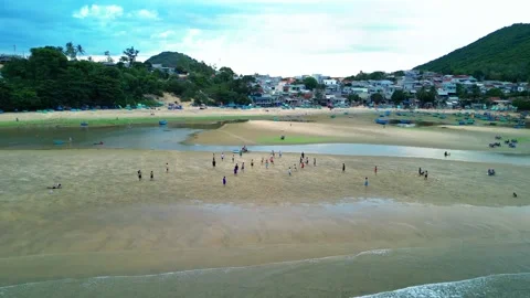 Editorial drone sweep of children playing soccer on beach at dusk 4K Stock Footage 340068752