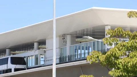 Editorial Footage - LAX SkyLink Train Departs Beyond Tree: May 7, 2026 Stock Footage 337678288