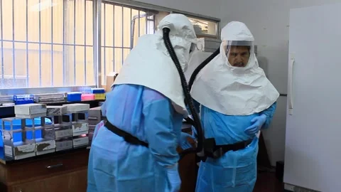 Editorial image of scientists wearing biosafe suits during pathogen outbreak Stock Footage 171395402