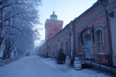 EDITORIAL: Jetty barracks and clock tower on winter morning in Suomenlinna. Stock Photos