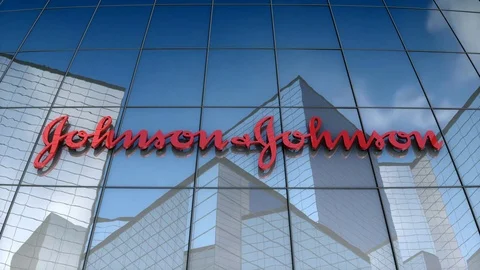 Editorial, Johnson &amp; Johnson logo on glass building.	 Stockbeeldmateriaal 79021580