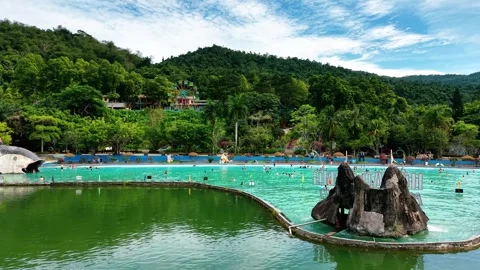 Editorial low altitude drone sweep past crowded pool at Ba Vi resort 4K Stock Footage 341551322