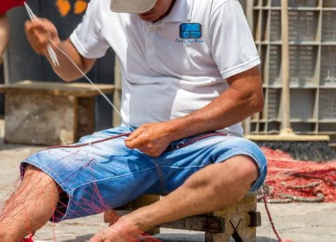 EDITORIAL, Net mending and patching Stock Photos