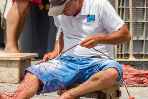 EDITORIAL, Net mending and patching Stock Photos