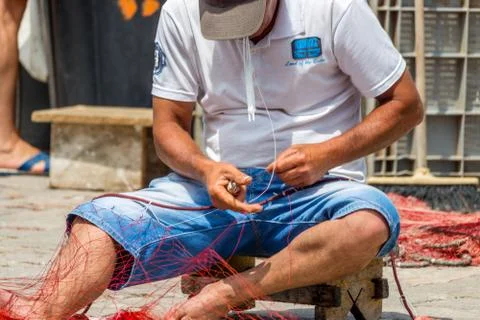 EDITORIAL, Net mending and patching Stock Photos