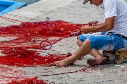 EDITORIAL, Net mending and patching Stock Photos