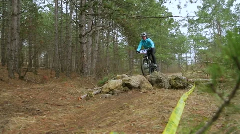 EDITORIAL. One Cyclist Falling From Bike In Green Forest Stock Footage 50449979