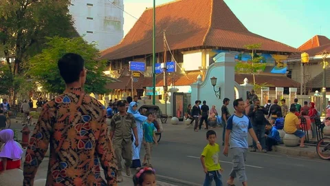 Editorial, A pedicab driver riding through the street of Malioboro Stock Footage 111581057