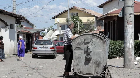 EDITORIAL: A Poor Man Digs In The Garbage Stock Footage 51136199