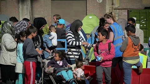 Editorial: The queue of hungry Syrian refugees for food in a camp for refugees Video stock 72927105