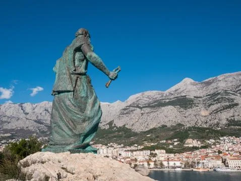 Editorial - Saint Peter monument in front of Makarska city Фото