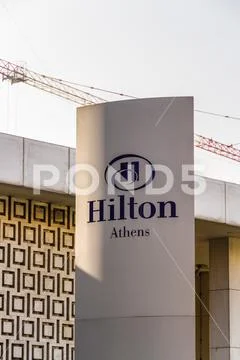 Editorial, Sign or logo for Hilton Athens Hotel Stock Photos