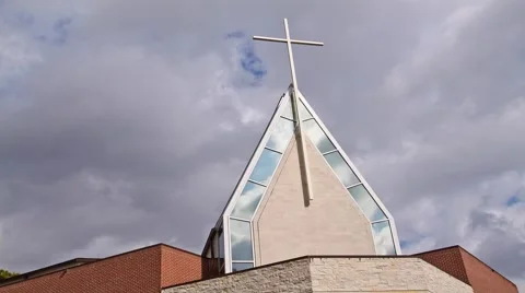 Editorial: Time Lapse of Clouds Passing Over Church with White Cross on Roof Video stock 1098416