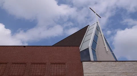 Editorial: Time Lapse of Clouds Passing Over Church with White Cross on Roof Stock Footage 1098429