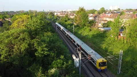 Editorial: Train Passing Through London Suburb, Acton, North London. 16th May 20 Video stock 275501922