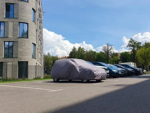 Editorial use only. a car with a protective covering, outside a suburban ho.. Stock Photos
