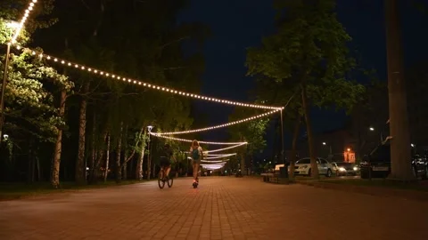 Editorial use only; People walk the footpaths at night in summer Stock Footage 157361674