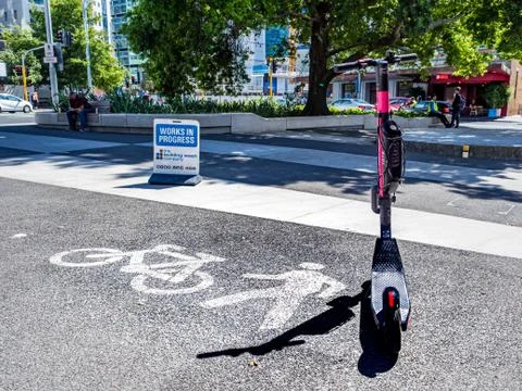 Editorial - What is the place of electric scooters in the city? Stock Photos