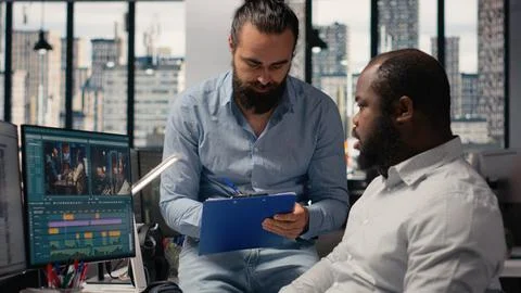 Editors team, refining video content, movie post production, agency studio Stock Photos