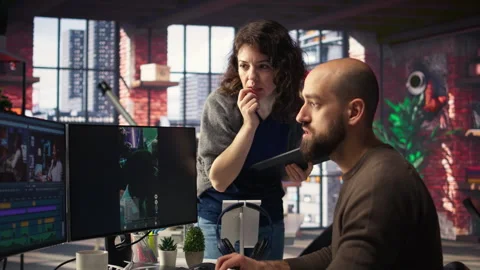 Editors team using videography software to create better content Stock Footage 308597598