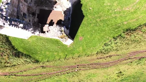 Edlingham Castle Ruins, top down aerial fly by Video stock 132289724