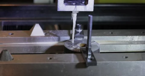 EDM CNC machine while cutting the sample work pieces. Cutting metal modern .. Stock Footage 231682922