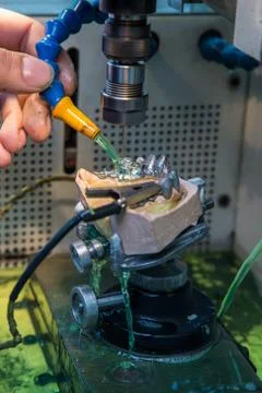 EDM machine for denture Stock Photos