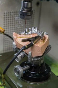 EDM machine for denture Stock Photos