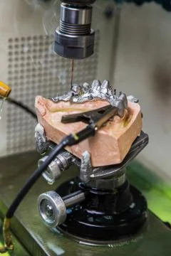 EDM machine for denture Stock Photos