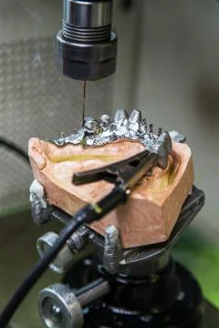 EDM machine for denture Stock Photos
