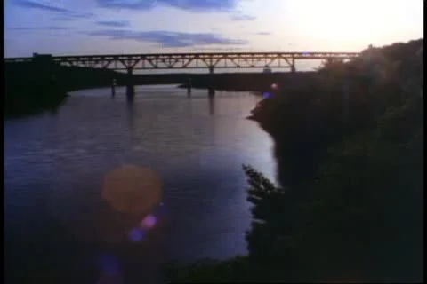 EDMONTON, ALBERTA, 1990, Sunset view with river and bridge, wide shot Stock Footage 20489465
