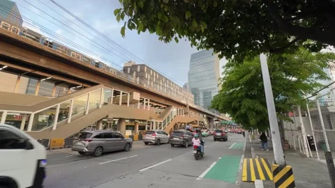 EDSA Ortigas Bus Rapid Transit Station Traffic Skyline Wide Shot 4K 60fps Vídeos de archivo 338186416