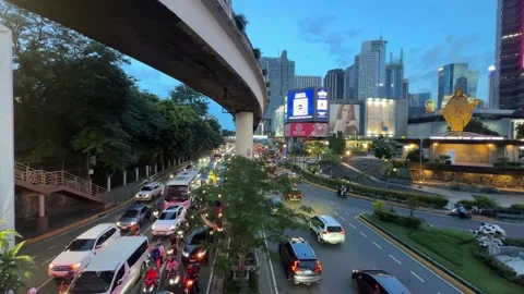 EDSA Ortigas Intersection Traffic LED Billboards Skyline Twilight Wide 4K 60fps Stock Footage 338186724