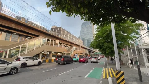 EDSA Ortigas MRT Train Over Bus Station Traffic City Skyline Wide Shot 4K 60fps Stock-Footage 338186419