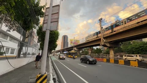 EDSA Ortigas Red SUV Traffic MRT Train Carousel Bus Golden Hour Wide 4K 60fps Stock Footage 338186672