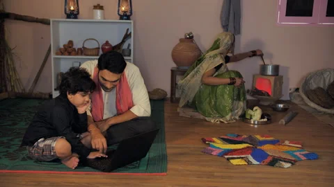 An educated farmer using a laptop with his adorable son - modern technology, ... 스톡 동영상 170037952