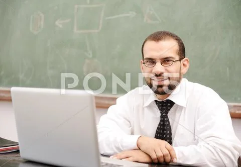 Education activities in classroom at school, happy teacher with laptop Stock Photos