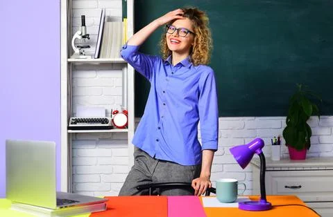 Education and learning. Back to school. Smiling school teacher, docent or uni Stock Photos