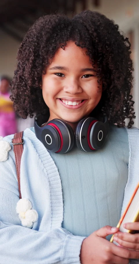 Education, book and face of child in school hallway for smile, knowledge and Stockbeeldmateriaal 341077859