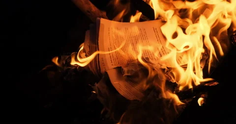 Education book on fire. Bright flame burning paper historic cultural publication Stock-Footage 132194098