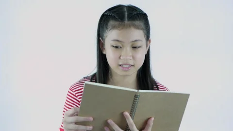 Education concept of 4k Resolution. Asian girl reading a book on a white ba.. Stock Footage 276578397