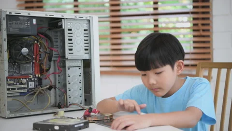 Education concept of 4k Resolution. The boy is learning to repair the compute Stock Footage 170159873