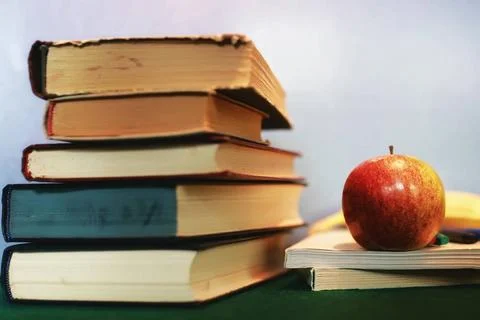 Education concept books stack, apple and pen textbooks to prepare for the ... Stock Photos