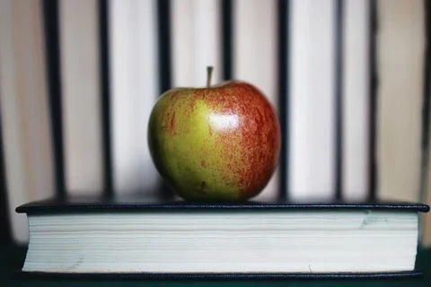 Education concept books stack, apple and pen Stock Photos